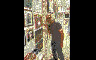 Pixelated male artist by work at The Art of Isolation